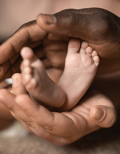 baby feet and parents hand Third-Party Reproductive programs